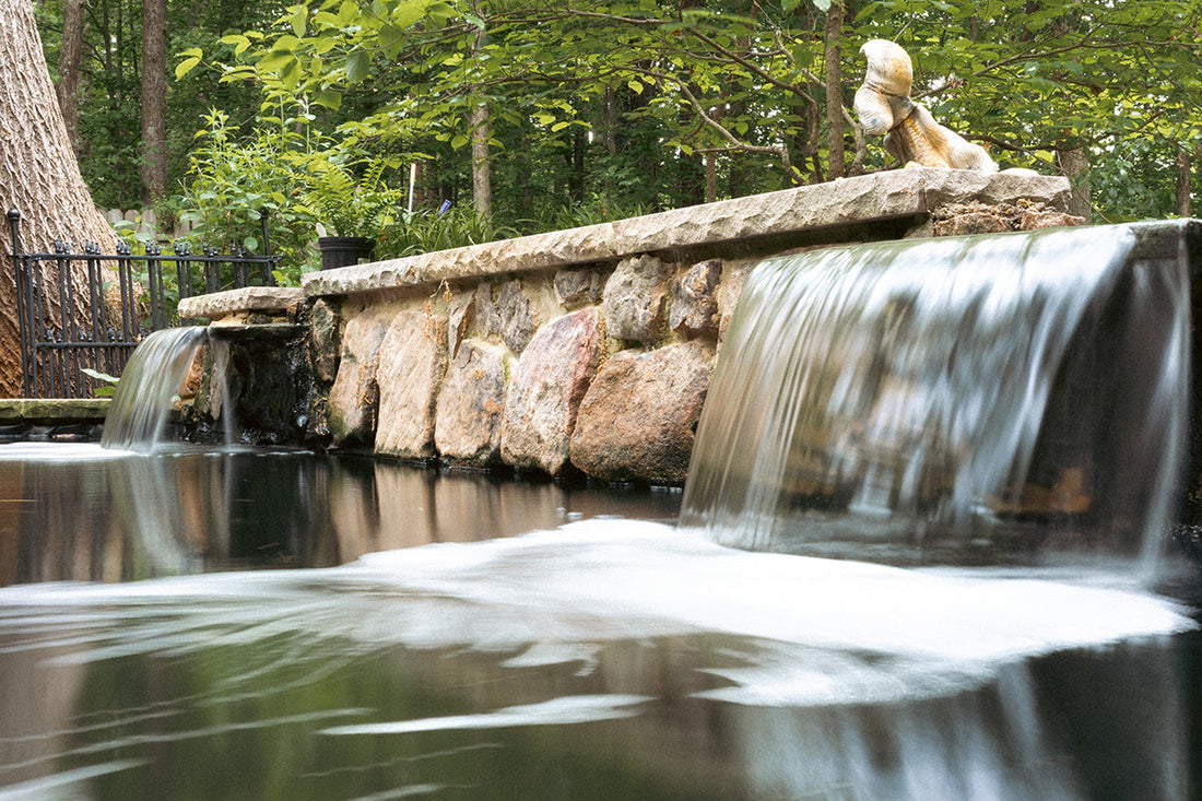 Beautiful double water feature at a 10,000 gallon pond
