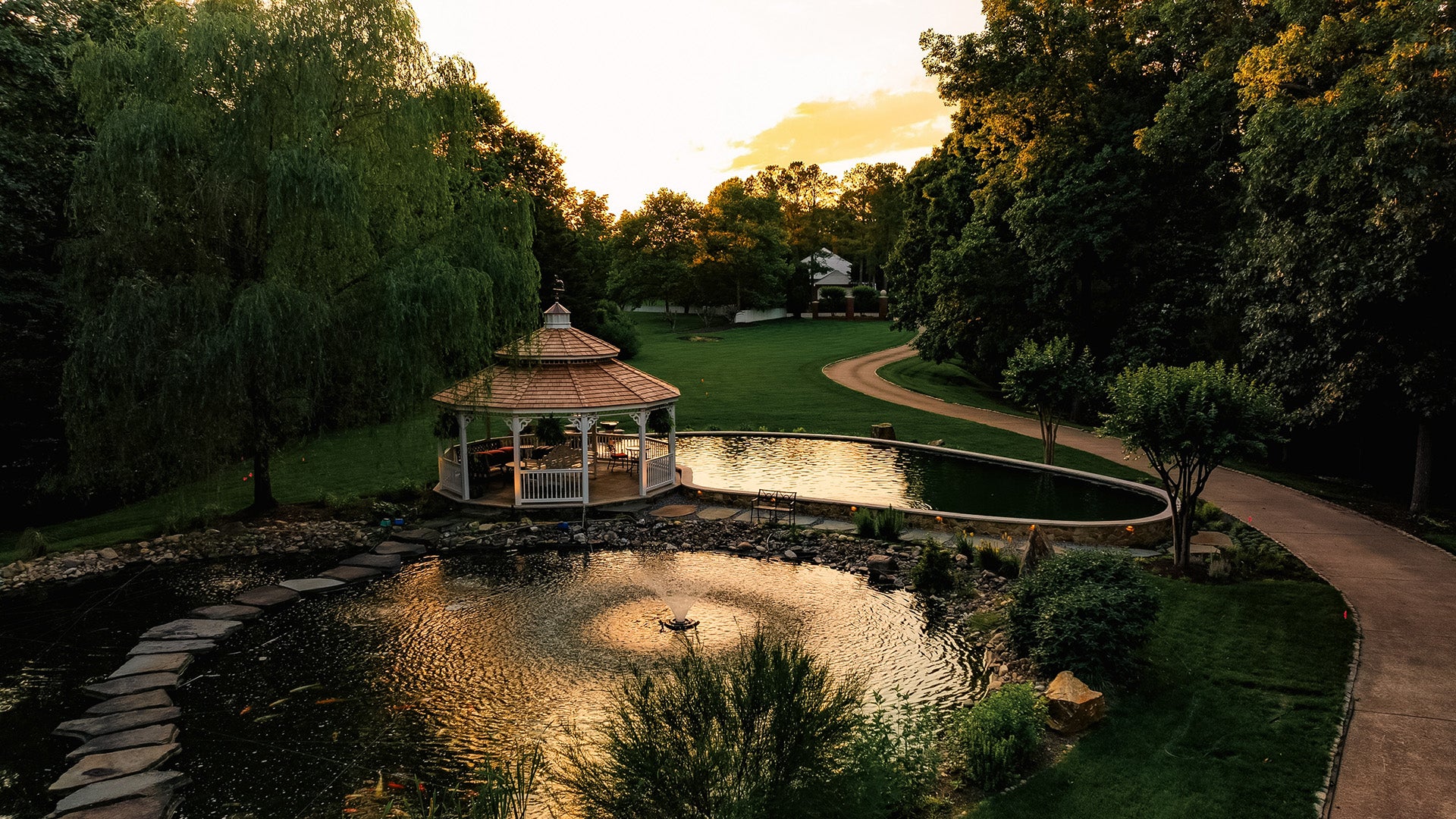 sunset over a beautiful koi pond